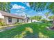 Beautifully maintained backyard featuring a well-kept lawn and mature trees providing shade and privacy at 5581 Se 35Th St, Ocala, FL 34480