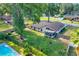 Expansive backyard with lush green grass, mature trees, partial privacy fence and a screened-in porch at 5581 Se 35Th St, Ocala, FL 34480