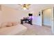 Neutral bedroom featuring a bed, desk, ceiling fan and closet at 5581 Se 35Th St, Ocala, FL 34480