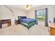 Cozy bedroom featuring a green bed frame, window with curtains, and comfortable carpet at 5581 Se 35Th St, Ocala, FL 34480