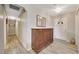 Bright foyer with wood-look flooring, decorative mirror, and closet space, offering a welcoming entrance at 5581 Se 35Th St, Ocala, FL 34480