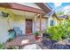 Charming front porch with a cozy seating area, colorful plants, and a welcoming entrance for guests at 5581 Se 35Th St, Ocala, FL 34480