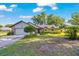Charming single-story home with a well-maintained front yard and inviting curb appeal with a garage and lovely landscaping at 5581 Se 35Th St, Ocala, FL 34480