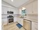 Well-equipped kitchen featuring stainless steel appliances, white cabinetry, and ample counter space at 5581 Se 35Th St, Ocala, FL 34480