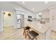 Bright modern kitchen with white cabinets, stainless steel appliances, and a center island with seating at 5581 Se 35Th St, Ocala, FL 34480