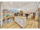 Bright open concept living space with an island, wood floors, lots of light, and inviting atmosphere at 5581 Se 35Th St, Ocala, FL 34480