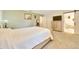 Relaxing main bedroom with soft carpet, wood furniture, ensuite bathroom, and a built-in television console at 5581 Se 35Th St, Ocala, FL 34480