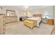 Inviting main bedroom with soft carpet, natural wood furniture, and a peaceful ambiance at 5581 Se 35Th St, Ocala, FL 34480
