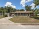 Charming home featuring a covered front porch and spacious front yard at 5915 Se Holly Rd, Belleview, FL 34420