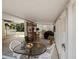 Spacious covered patio area with seating and outdoor kitchen setup at 5915 Se Holly Rd, Belleview, FL 34420