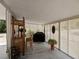 Relaxing covered patio with a bar, grill, and privacy lattice at 5915 Se Holly Rd, Belleview, FL 34420