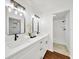 Bathroom featuring double sink vanity, modern fixtures, and walk-in shower at 6142 Se 37Th Ter, Ocala, FL 34480