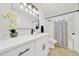 Contemporary bathroom featuring a white vanity, quartz countertops, updated fixtures, and shower-tub combo at 6142 Se 37Th Ter, Ocala, FL 34480