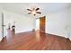 Bedroom with wood floors and fan at 6142 Se 37Th Ter, Ocala, FL 34480
