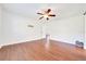 Bedroom with wood floors and ceiling fan at 6142 Se 37Th Ter, Ocala, FL 34480