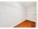Walk-in closet with wooden floors and adjustable wire shelving for customizable storage solutions at 6142 Se 37Th Ter, Ocala, FL 34480