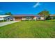Charming brick single-story home with well-manicured lawn and a durable metal roof at 6142 Se 37Th Ter, Ocala, FL 34480