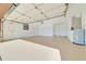 Spacious two car garage, with epoxy flooring and white walls at 6142 Se 37Th Ter, Ocala, FL 34480