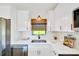 Bright kitchen with white countertops, cabinets and stainless steel appliances at 6142 Se 37Th Ter, Ocala, FL 34480