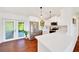 Modern kitchen with white cabinets, stainless steel appliances, and a quartz countertop at 6142 Se 37Th Ter, Ocala, FL 34480