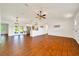Bright, open living area with hardwood floors and white walls creating a spacious atmosphere at 6142 Se 37Th Ter, Ocala, FL 34480