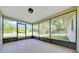 Relaxing screened porch with a serene backyard view, perfect for outdoor enjoyment at 6142 Se 37Th Ter, Ocala, FL 34480