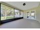 Inviting screened porch with access to backyard and living area, enhancing indoor-outdoor living at 6142 Se 37Th Ter, Ocala, FL 34480