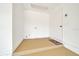 Compact utility room featuring durable flooring, white walls, and exterior access at 6142 Se 37Th Ter, Ocala, FL 34480