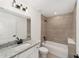 Bathroom with granite vanity, shower, and tub at 681 Sw Fig Tree Ln, Dunnellon, FL 34431