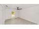Bright bedroom with luxury vinyl floors and a window with a nature view at 681 Sw Fig Tree Ln, Dunnellon, FL 34431