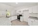 Modern kitchen featuring granite countertops, stainless steel appliances, and ample cabinet space at 681 Sw Fig Tree Ln, Dunnellon, FL 34431