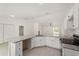 Well-lit kitchen with granite countertops, stainless steel appliances, and open layout at 681 Sw Fig Tree Ln, Dunnellon, FL 34431