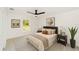 Bright bedroom with stylish decor, a ceiling fan, and a neutral color palette at 732 Sw Fig Tree Ln, Dunnellon, FL 34431