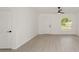 Bright living space with neutral walls, contemporary fan, and updated flooring, showcasing a minimalist design at 732 Sw Fig Tree Ln, Dunnellon, FL 34431