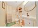 Well-lit bathroom features a shower and tub, a sink, and neutral decor at 7327 Sw 129Th Ln, Ocala, FL 34473