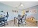 Bedroom with laminate floors, desk, and an abundance of natural light at 7327 Sw 129Th Ln, Ocala, FL 34473