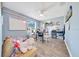 Bright bedroom with light blue walls, hardwood floors, and a ceiling fan at 7327 Sw 129Th Ln, Ocala, FL 34473