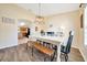 Bright dining room with hardwood floors, white table, and room to gather and entertain at 7327 Sw 129Th Ln, Ocala, FL 34473