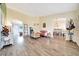 Open-concept living room features modern flooring and an abundance of natural light at 7327 Sw 129Th Ln, Ocala, FL 34473
