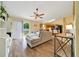Open concept living space with sliding door to backyard and breakfast bar to kitchen at 7327 Sw 129Th Ln, Ocala, FL 34473
