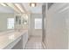 Bright bathroom with a double sink vanity, tiled floors, and a walk-in shower at 8128 Sw 117Th Loop Loop, Ocala, FL 34481