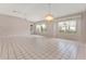 Bright living room features tile floors, chandelier and large windows with backyard view at 8128 Sw 117Th Loop Loop, Ocala, FL 34481