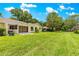 Spacious backyard with a screened lanai, perfect for outdoor living at 8351 Sw 93Rd Ln # C, Ocala, FL 34481