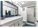 Bathroom with a tiled glass-door shower, tiled flooring, and a vintage vanity at 8351 Sw 93Rd Ln # C, Ocala, FL 34481