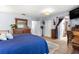 Comfortable bedroom with wood floors, dresser, and ample natural light from the exterior windows at 8351 Sw 93Rd Ln # C, Ocala, FL 34481