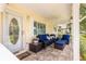 Cozy front porch with comfortable seating, ceiling fan, and a charming view of the neighborhood at 8351 Sw 93Rd Ln # C, Ocala, FL 34481
