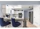 Modern kitchen with white cabinets, stainless steel appliances, granite countertops, and an open design at 8351 Sw 93Rd Ln # C, Ocala, FL 34481