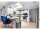 Modern kitchen with white cabinets, stainless steel appliances, granite countertops, and an open design at 8351 Sw 93Rd Ln # C, Ocala, FL 34481