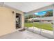 Covered patio with access to the house and a view of the landscaped backyard at 8351 Sw 93Rd Ln # C, Ocala, FL 34481
