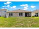 Home exterior overlooking a sprawling backyard with a screened-in porch at 8685 Sw 49Th Cir, Ocala, FL 34476